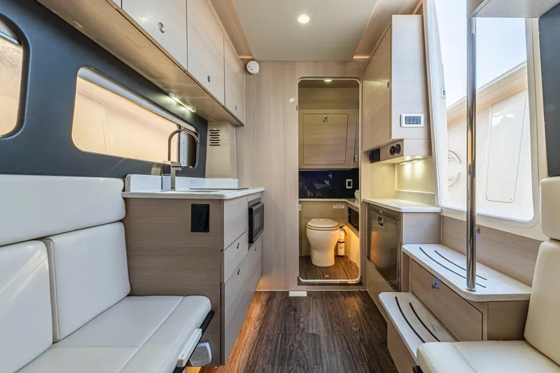  Yacht Photos Pics Luxurious interior of 2023 Scout 425 LXF boat with modern amenities and sleek design.