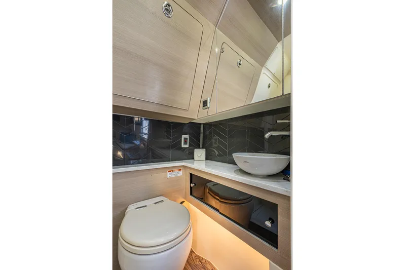  Yacht Photos Pics 2023 Scout 425 LXF boat bathroom with modern fixtures and sleek design.