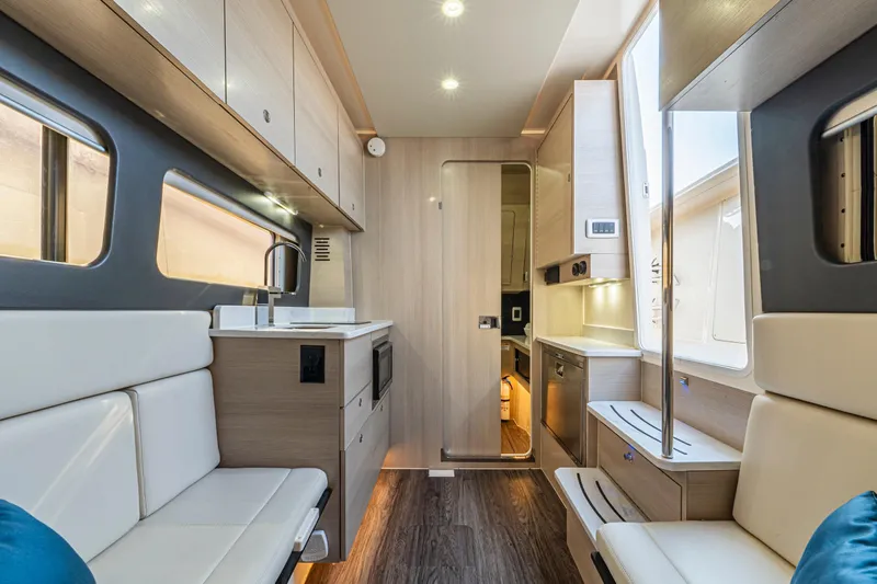  Yacht Photos Pics Luxurious interior of 2023 Scout 425 LXF boat with modern amenities and sleek design.