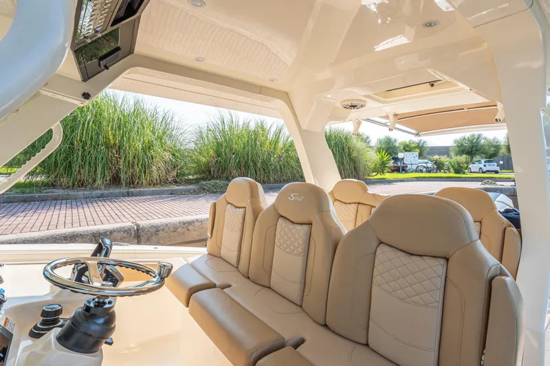  Yacht Photos Pics Luxurious interior of 2023 Scout 425 LXF boat with beige leather seating.