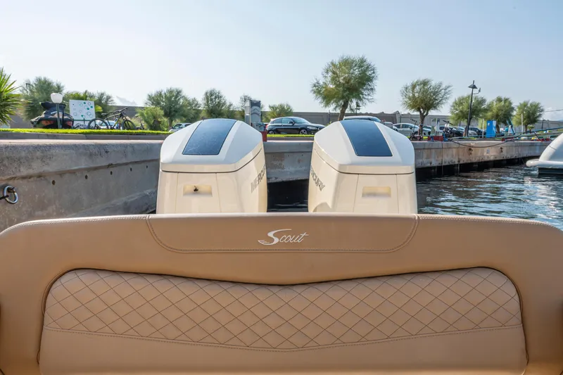  Yacht Photos Pics 2023 Scout 425 LXF boat with dual Mercury outboard engines at a dock.