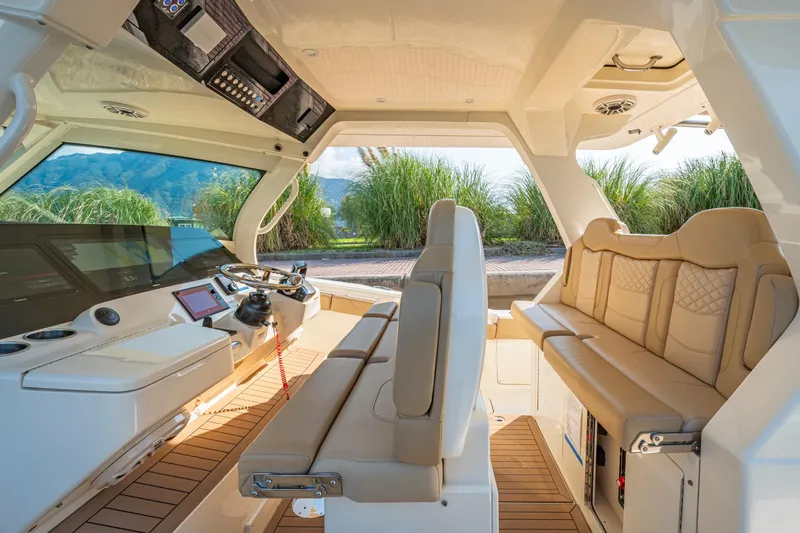  Yacht Photos Pics Luxurious interior of 2023 Scout 425 LXF boat with plush seating and modern controls.