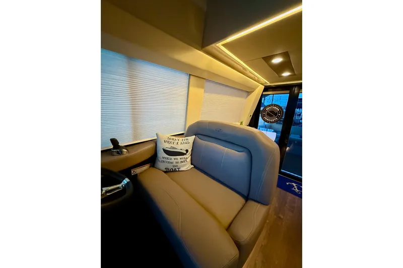  Yacht Photos Pics Interior of 2018 Regal 42 Grande Coupe with cozy seating and decorative pillows.