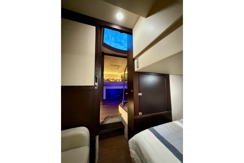  Yacht Photos Pics Interior view of 2018 Regal 42 Grande Coupe yacht, featuring modern design and ambient lighting.