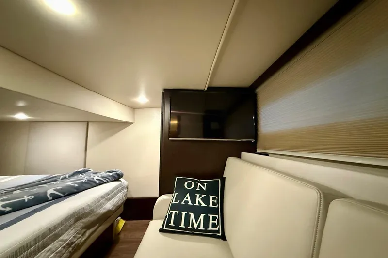  Yacht Photos Pics Interior of 2018 Regal 42 Grande Coupe with cozy seating and "On Lake Time" pillow.