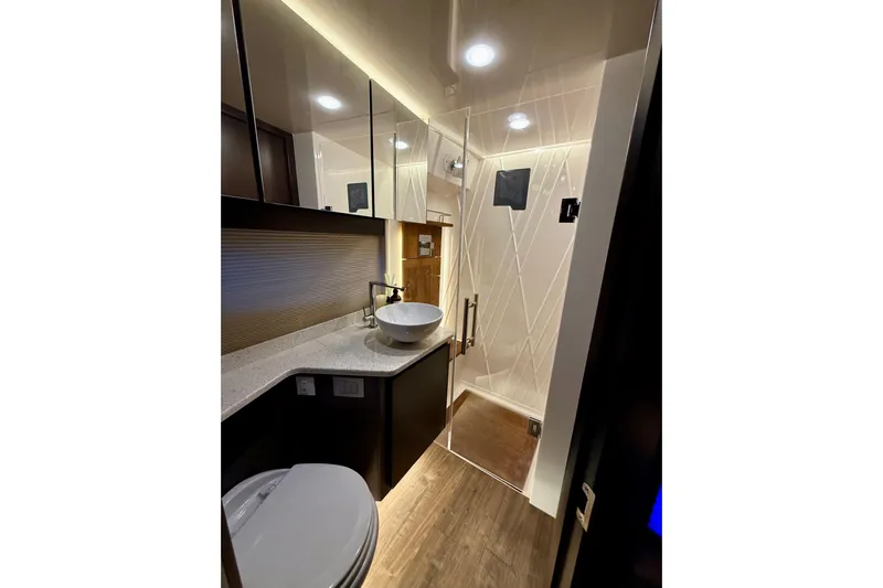  Yacht Photos Pics Luxurious bathroom in 2018 Regal 42 Grande Coupe yacht with modern fixtures and elegant design.