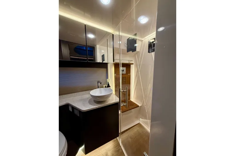  Yacht Photos Pics Luxurious bathroom interior of 2018 Regal 42 Grande Coupe yacht, featuring modern fixtures and elegant design.
