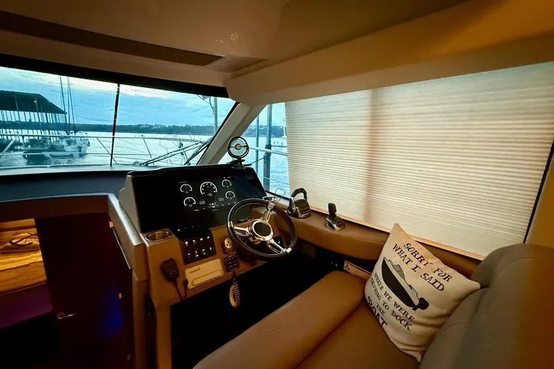  Yacht Photos Pics 2018 Regal 42 Grande Coupe helm with scenic marina view and cozy seating.