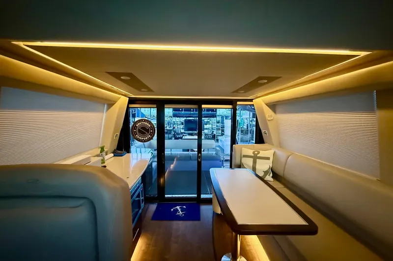  Yacht Photos Pics Luxurious interior of 2018 Regal 42 Grande Coupe yacht with elegant seating and ambient lighting.