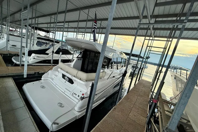  Yacht Photos Pics 2018 Regal 42 Grande Coupe docked in a marina at sunset.