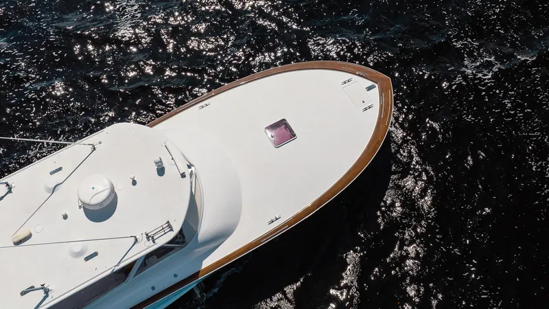 Here Fishy Fishy Yacht Photos Pics Aerial view of 2012 Winter Custom Yachts 38 Express on dark water.