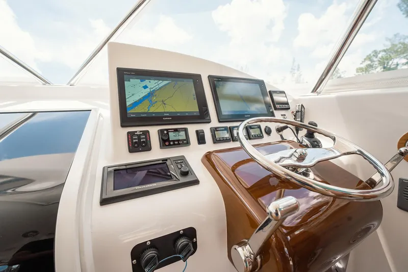 Here Fishy Fishy Yacht Photos Pics Helm of 2012 Winter Custom Yachts 38 Express with navigation screens and controls.