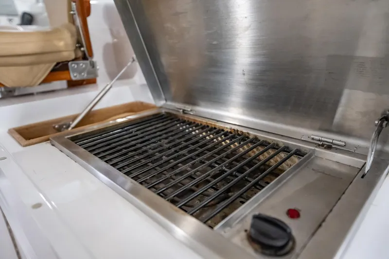 Here Fishy Fishy Yacht Photos Pics Stainless steel grill on 2012 Winter Custom Yachts 38 Express boat.