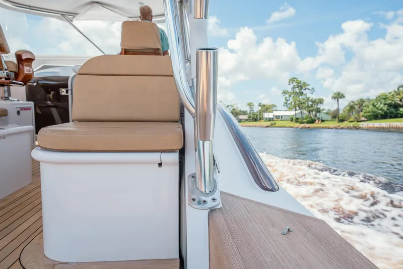 Here Fishy Fishy Yacht Photos Pics 2012 Winter Custom Yachts 38 Express cruising on a sunny day, showcasing deck and seating.