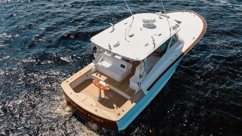 Here Fishy Fishy Yacht Photos Pics 2012 Winter Custom Yachts 38 Express cruising on open water, aerial view.