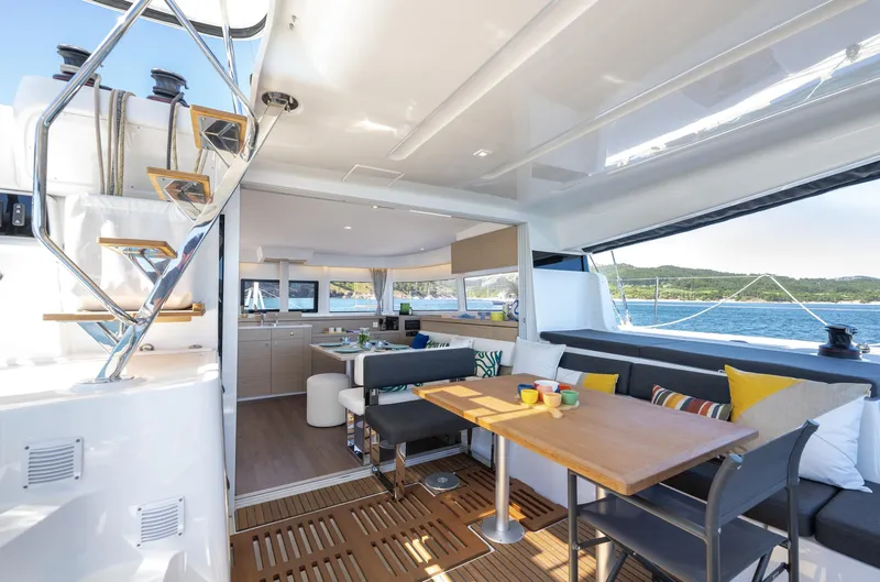  Yacht Photos Pics Luxurious interior of 2026 Lagoon 43 yacht with modern seating and ocean view.