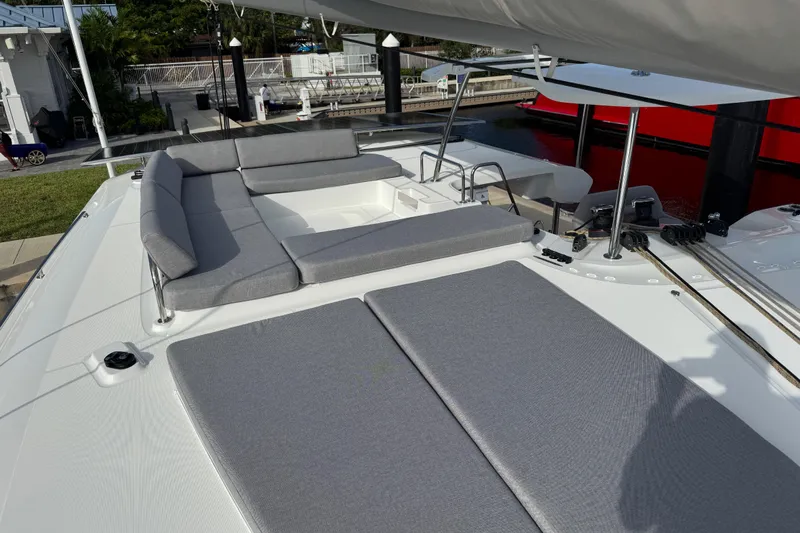  Yacht Photos Pics Luxurious 2026 Lagoon 43 yacht deck with comfortable gray seating and modern design.
