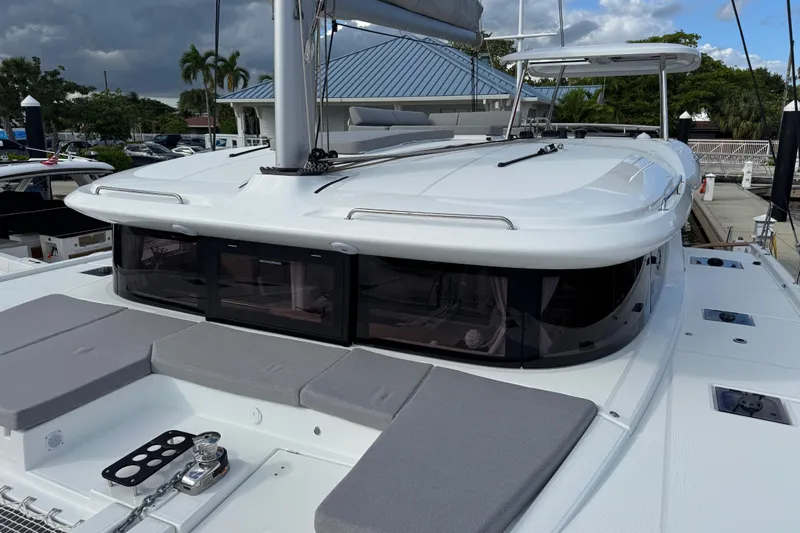  Yacht Photos Pics 2026 Lagoon 43 yacht with sleek design, docked under cloudy skies.