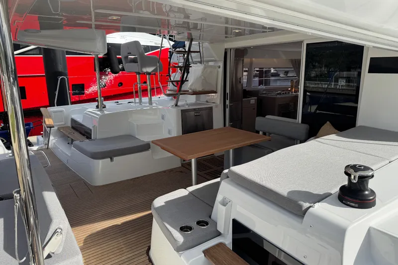  Yacht Photos Pics Luxurious Lagoon 43 yacht interior, featuring modern seating and dining area, 2026 model.