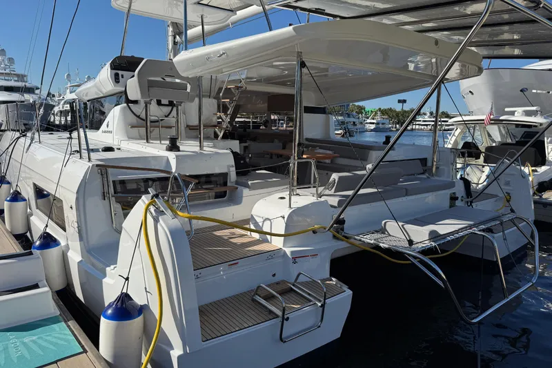  Yacht Photos Pics 2026 Lagoon 43 yacht docked, featuring spacious deck and modern design.