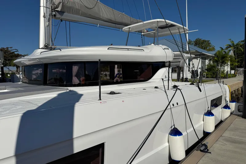  Yacht Photos Pics 2026 Lagoon 43 catamaran docked, featuring sleek design and modern amenities.