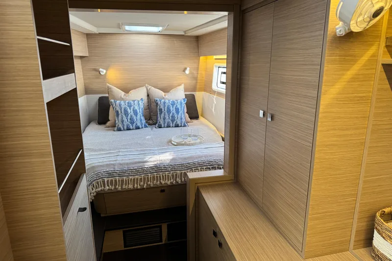  Yacht Photos Pics Luxurious interior of 2026 Lagoon 43 yacht with cozy bedroom and modern design.