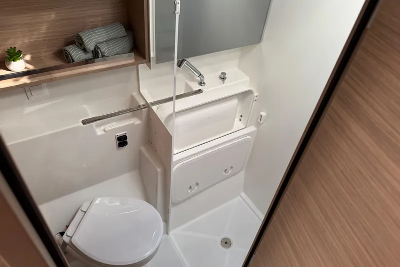  Yacht Photos Pics Modern bathroom in 2026 Lagoon 43 yacht with compact design and sleek fixtures.