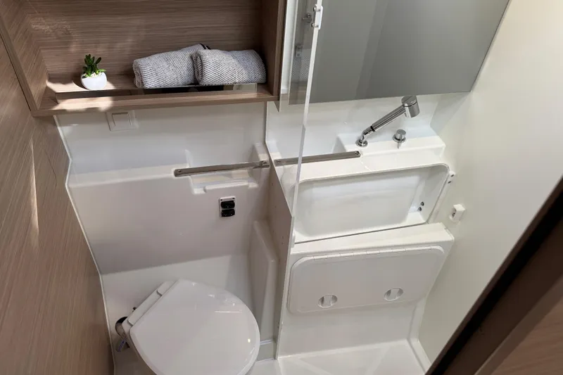  Yacht Photos Pics Modern bathroom in 2026 Lagoon 43 yacht with compact design and sleek fixtures.