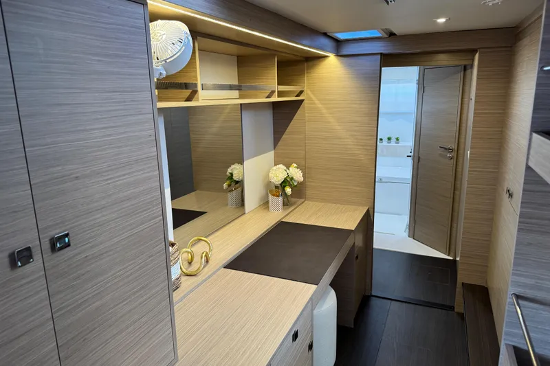  Yacht Photos Pics Luxurious interior of 2026 Lagoon 43 yacht with modern wood finish and elegant decor.