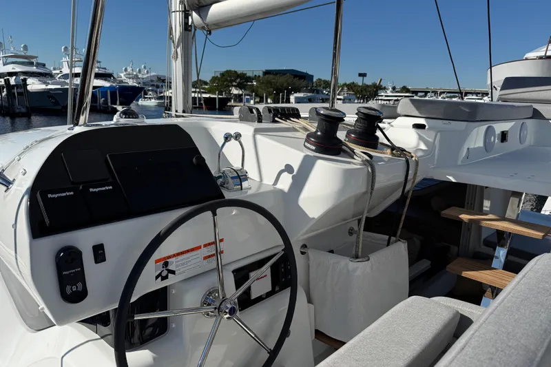 Yacht Photos Pics Helm of 2026 Lagoon 43 yacht with modern navigation equipment and seating.
