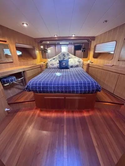Marsea Yacht Photos Pics Luxurious cabin interior of 1994 Johnson High Tech Euro 56 yacht with wooden finish.
