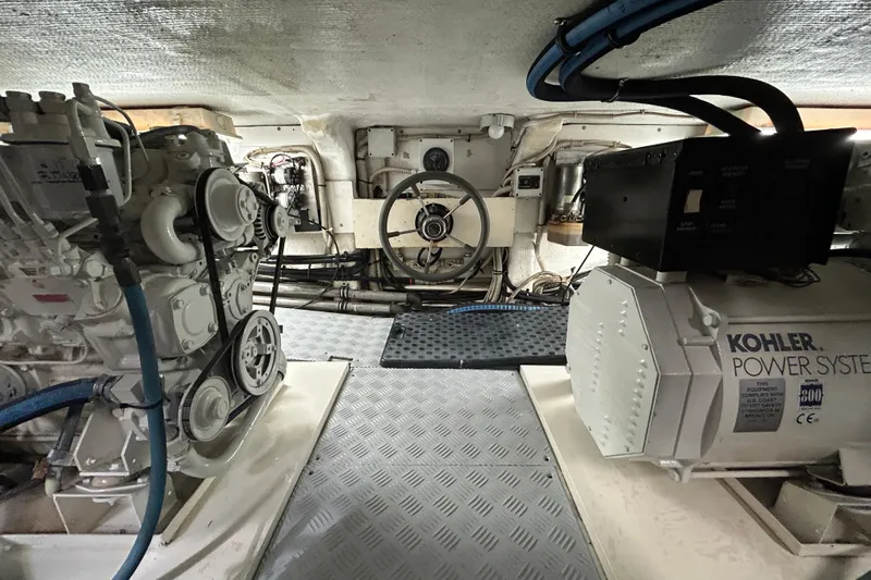 Gabriela G Yacht Photos Pics Engine room of a 2001 Mangusta 72 yacht with Kohler power system and mechanical components.
