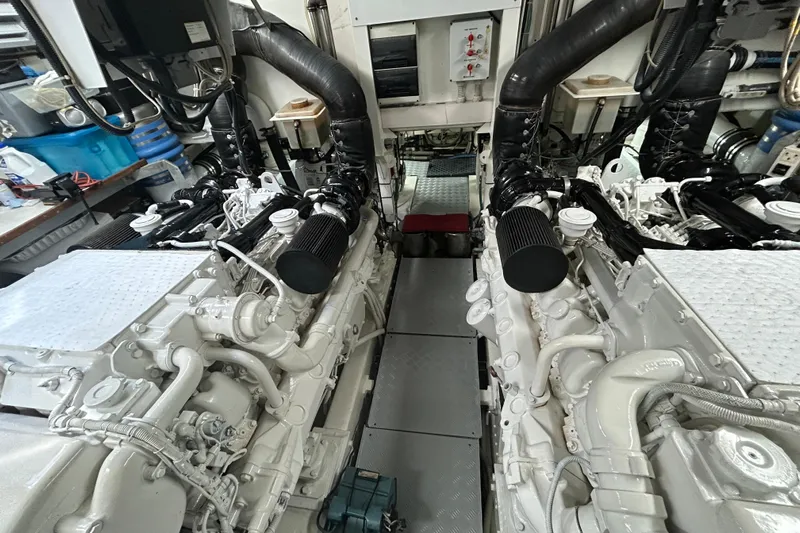Gabriela G Yacht Photos Pics Engine room of a 2001 Mangusta 72 yacht, showcasing dual engines and mechanical components.
