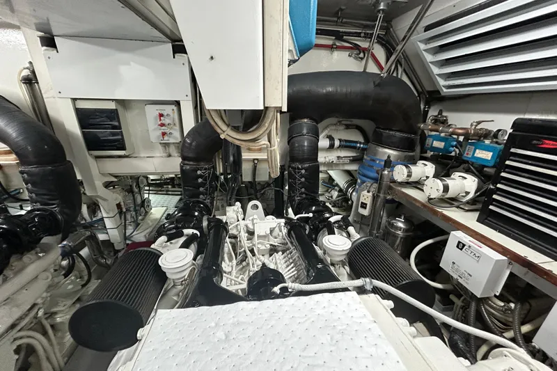 Gabriela G Yacht Photos Pics Engine room of a 2001 Mangusta 72 yacht, showcasing complex machinery and components.