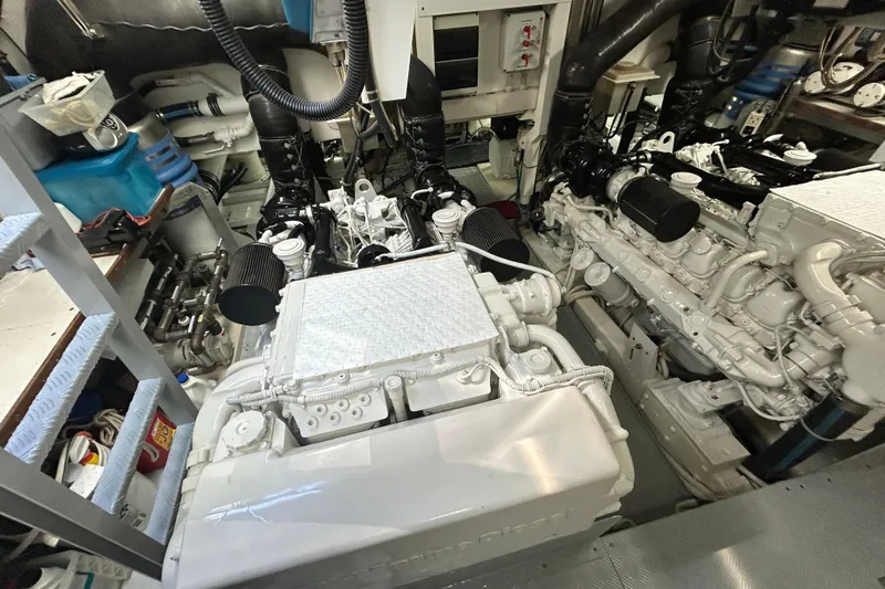 Gabriela G Yacht Photos Pics Engine room of a 2001 Mangusta 72 yacht, showcasing dual engines and mechanical components.