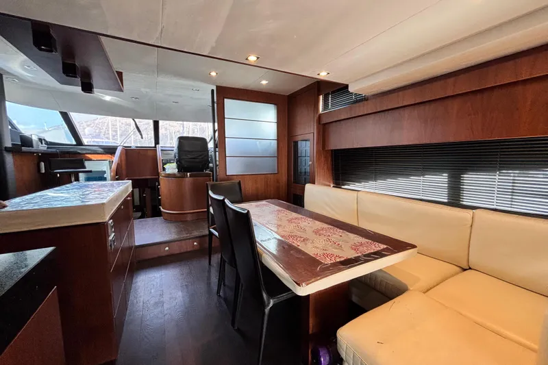  Yacht Photos Pics Luxurious interior of 2014 Fairline Squadron 78 yacht with elegant dining area and helm.