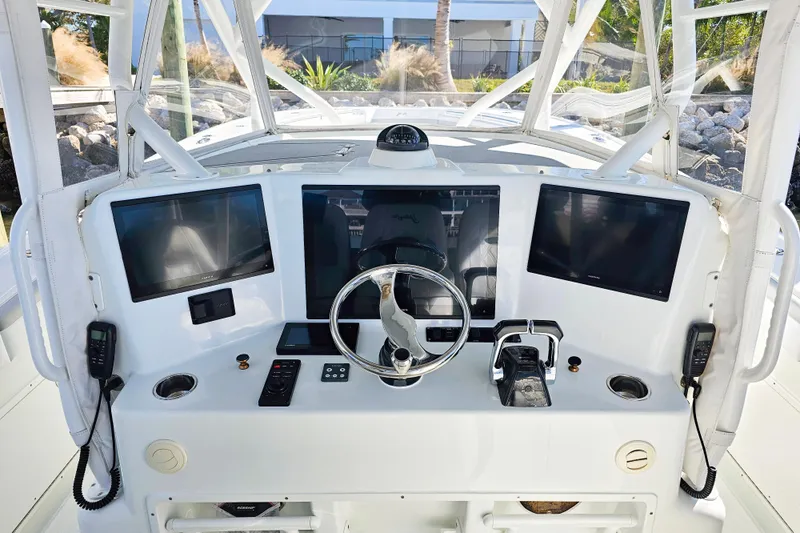 Contingensea Yacht Photos Pics 2015 Yellowfin 42 Offshore boat dashboard with modern navigation equipment and controls.