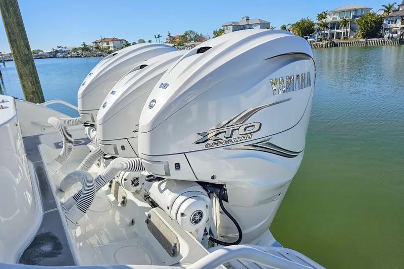 Contingensea Yacht Photos Pics 2015 Yellowfin 42 Offshore boat with Yamaha XTO Offshore engines, docked by waterfront homes.