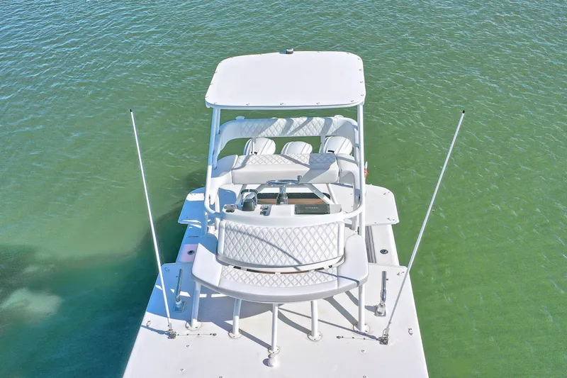 Contingensea Yacht Photos Pics Aerial view of 2015 Yellowfin 42 Offshore boat on green water.