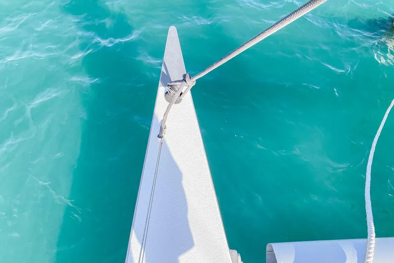  Yacht Photos Pics Bow of Custom BBL 54' yacht on turquoise water, 2004 model.