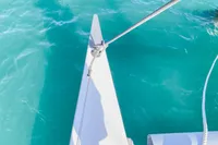Bow of Custom BBL 54' yacht on turquoise water, 2004 model.