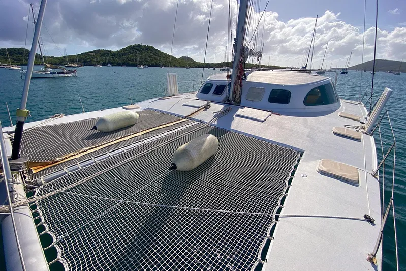  Yacht Photos Pics Custom BBL 54' catamaran on water, 2004 model, with netted deck and scenic background.