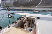 Sailing yacht deck view, Custom BBL 54', 2004, anchored in a scenic marina.