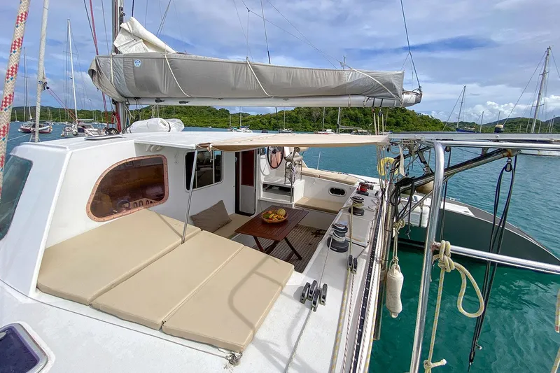  Yacht Photos Pics Sailing yacht Custom BBL 54', 2004 model, with spacious deck and seating area, docked in marina.