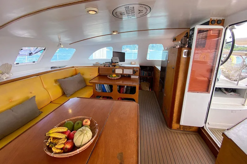  Yacht Photos Pics Interior of 2004 Custom BBL 54' yacht with cozy seating and fruit basket.