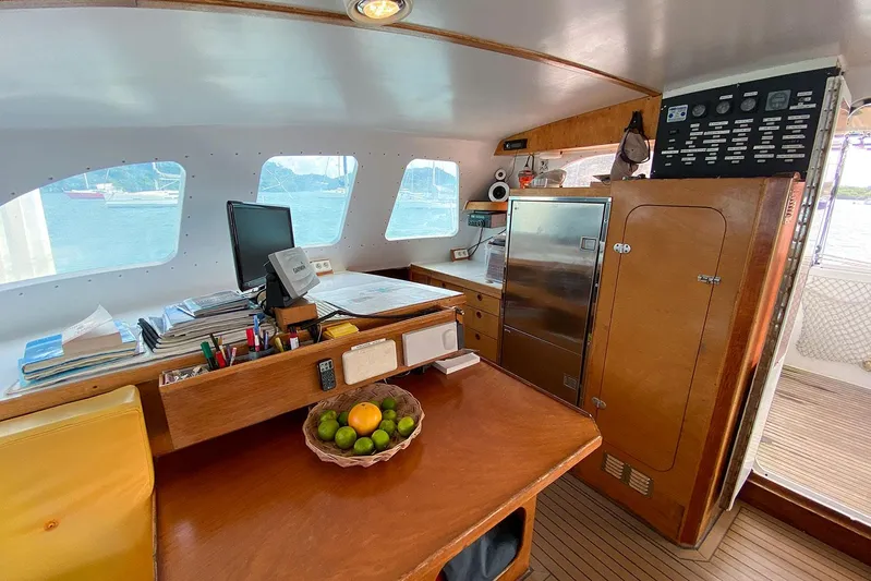  Yacht Photos Pics Interior of a 2004 Custom BBL 54' yacht with wooden cabinetry and navigation equipment.