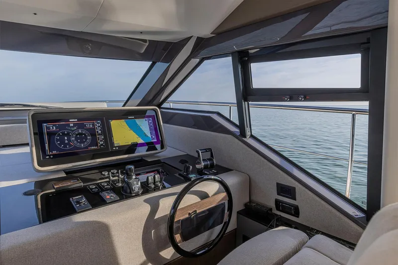 Our Trade Yacht Photos Pics 2024 Ferretti Yachts 580 helm with advanced navigation system and ocean view.