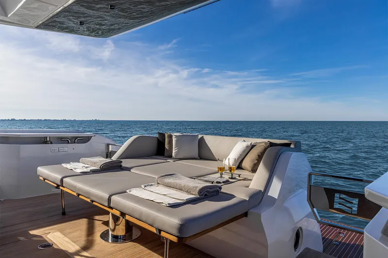 Our Trade Yacht Photos Pics Luxurious 2024 Ferretti Yachts 580 deck with sun loungers and ocean view.
