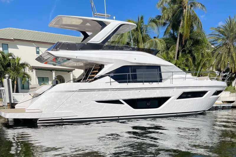 Our Trade Yacht Photos Pics 2024 Ferretti Yachts 580 docked, showcasing sleek design and modern architecture.