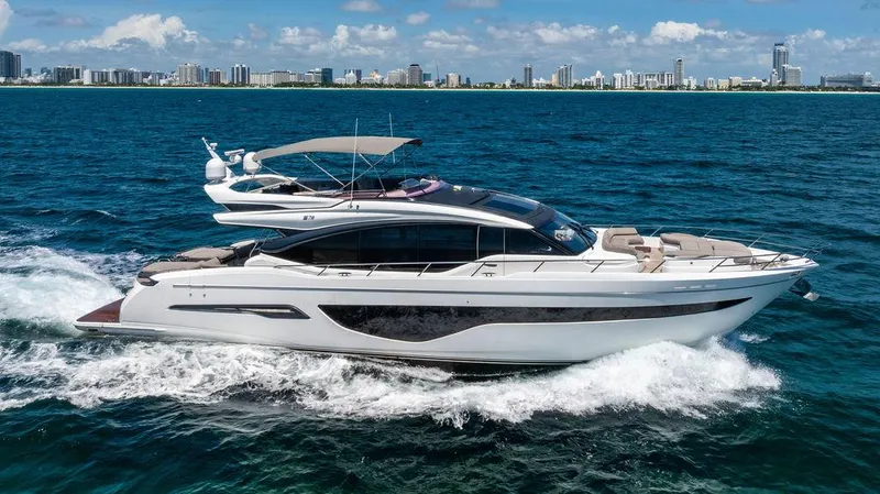 Cocoon Yacht Photos Pics Luxury 2021 Princess S78 yacht cruising on ocean near city skyline.